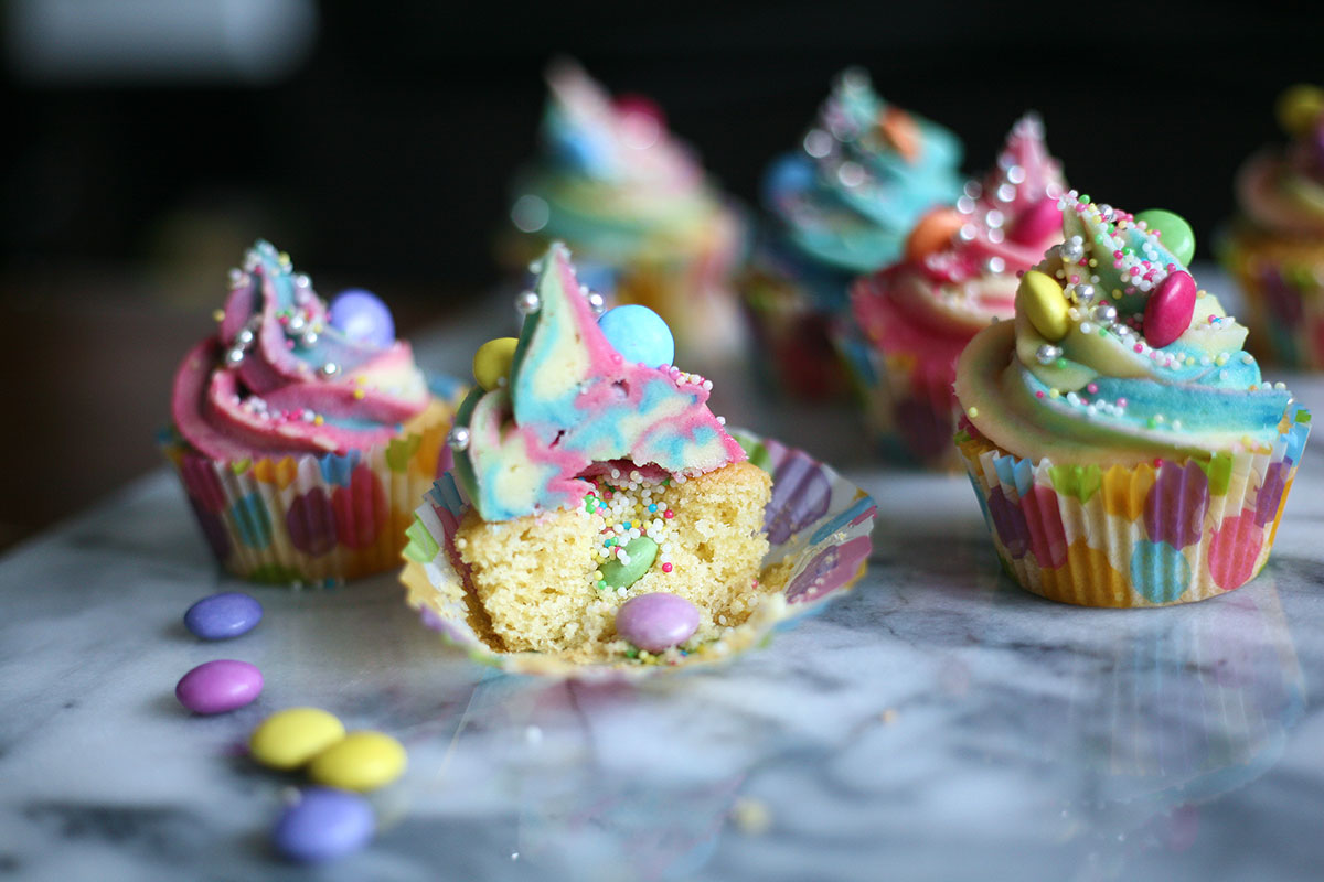 Unicorn cupcakes with an exploding rainbow centre