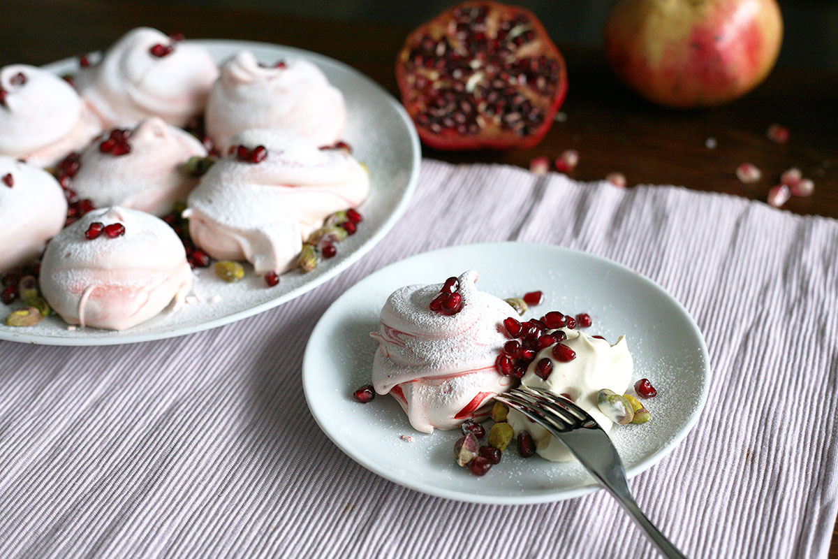 Rose meringues with pomegranates and pistachios