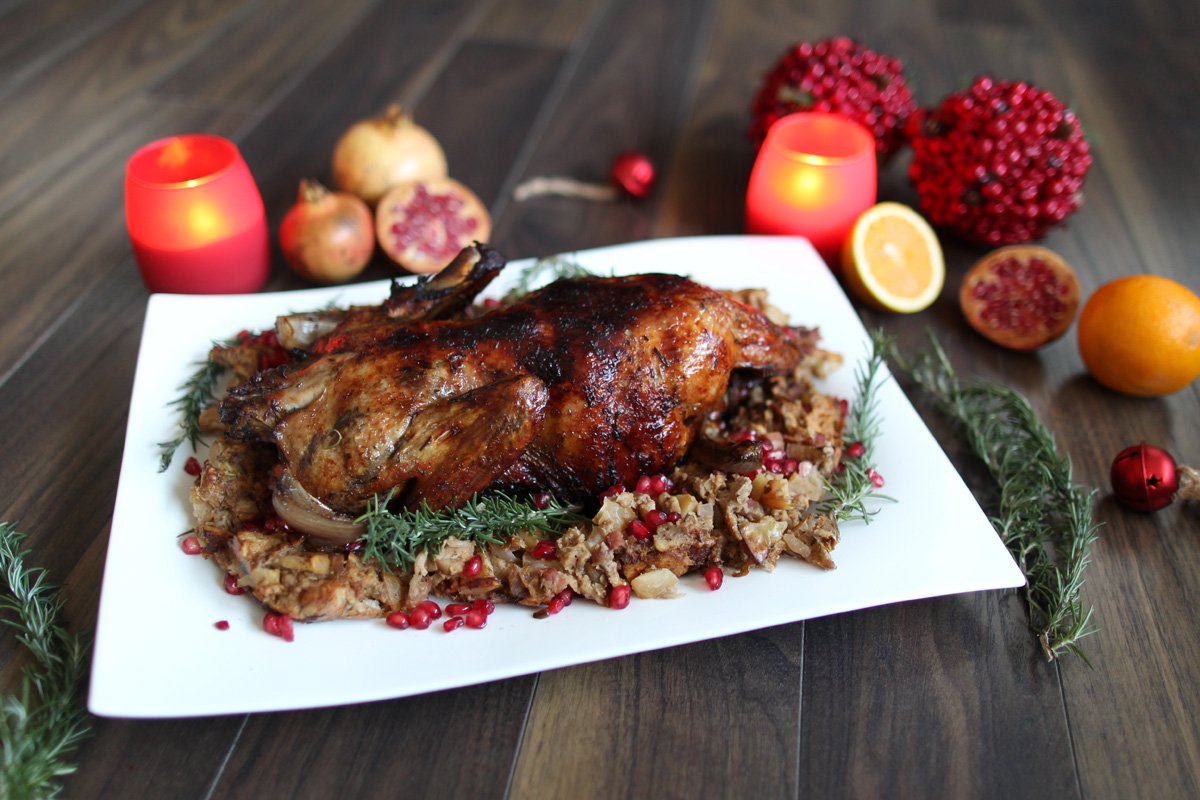 Rum and pomegranate roast duck with walnut and apple stuffing